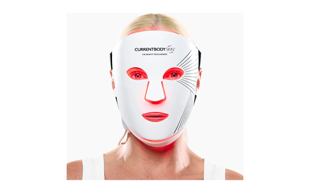CurrentBody LED mask review: a model wearing the Series 2 mask with its red lights on