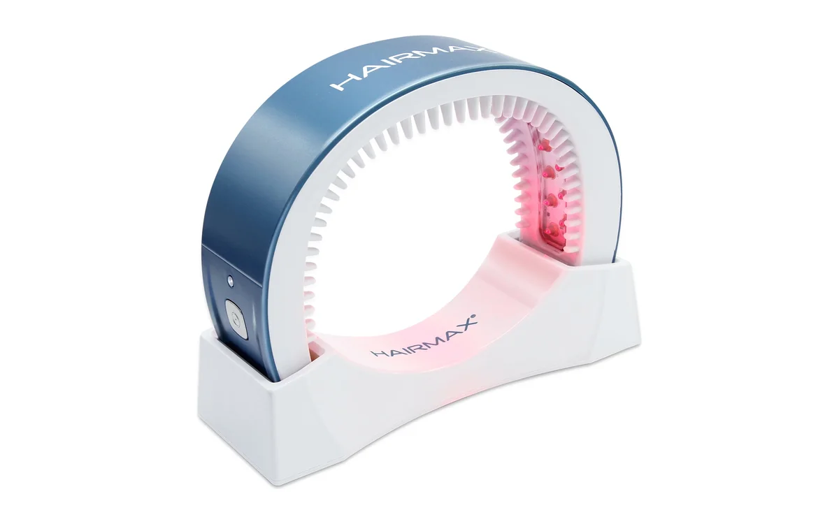 HairMax LaserBand 41 ComfortFlex laser band in its charging cradle
