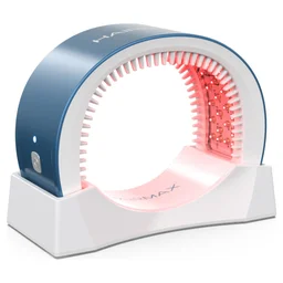 HairMax LaserBand 82 ComfortFlex in its charging cradle