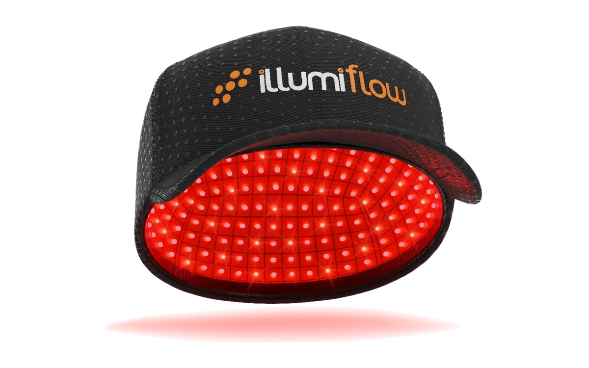 Illumiflow 272 Pro laser cap with its red laser diodes lit