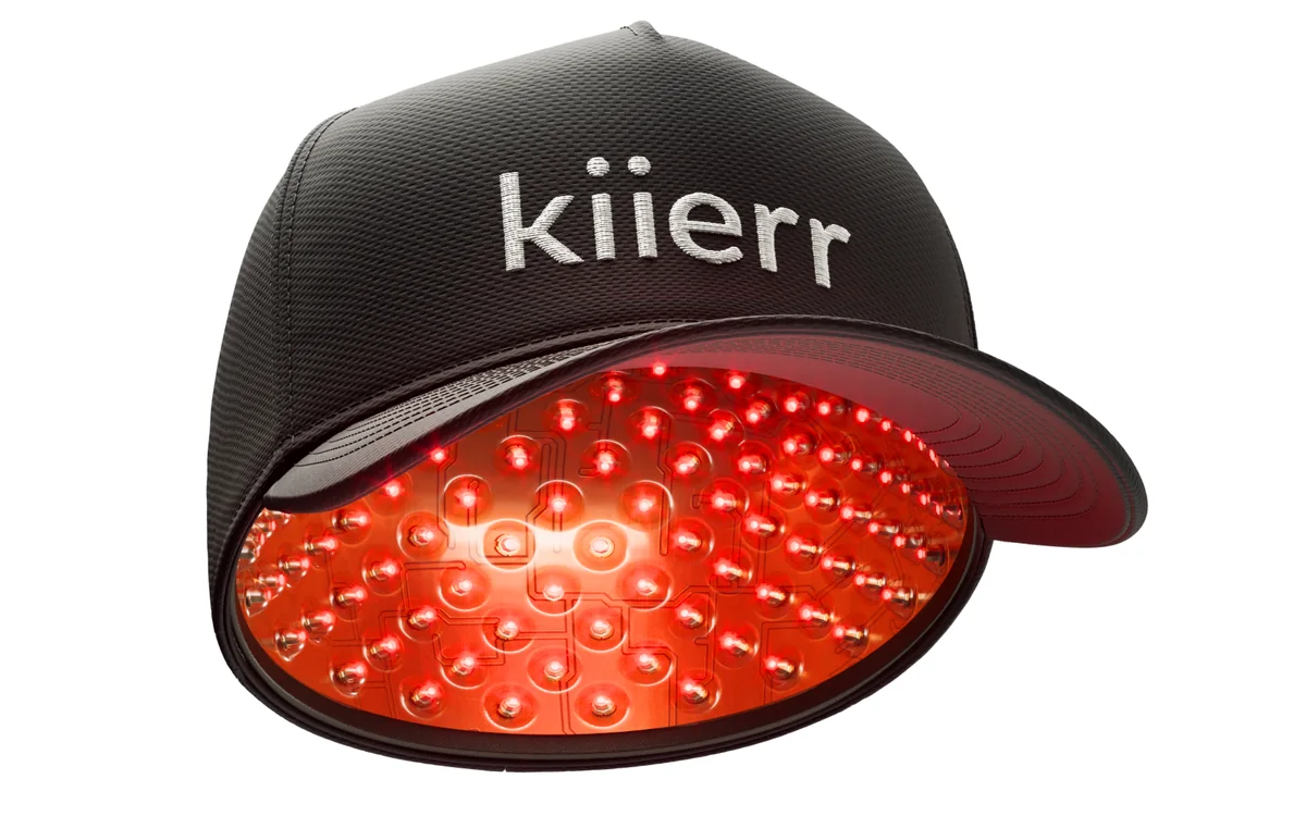 A laser hair growth cap with rows of red laser diodes on the inside