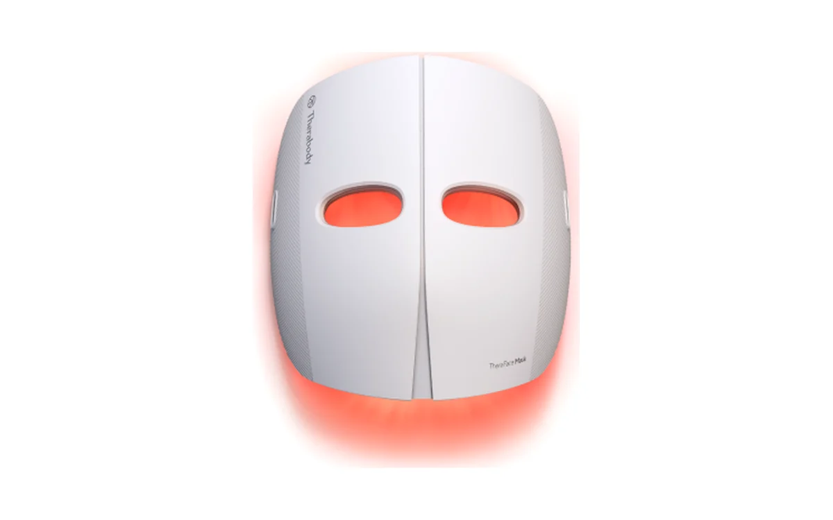 Therabody TheraFace Mask, a white rigid LED mask with eye openings